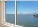Expansive water view seen through window, showcasing calm waters and distant skyline at 6075 Shore S Blvd # 501, Gulfport, FL 33707