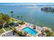 Relaxing waterfront pool with surrounding lounge chairs at 6075 Shore S Blvd # 501, Gulfport, FL 33707
