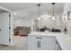 Open concept kitchen with island, looking into dining area at 9124 Lido Ln, Port Richey, FL 34668