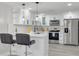 Modern kitchen with white cabinets and stainless steel appliances at 9124 Lido Ln, Port Richey, FL 34668