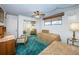 Bedroom featuring two beds, side tables, carpet and window with blinds at 300 Woodette Dr # 202B, Dunedin, FL 34698