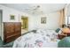 Bright bedroom with twin beds, mirrored closet doors, and carpet floors at 300 Woodette Dr # 202B, Dunedin, FL 34698