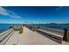 Picturesque dock with benches overlooking the serene water, offering a tranquil spot to relax and enjoy waterfront views at 300 Woodette Dr # 202B, Dunedin, FL 34698