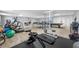 Spacious gym featuring exercise equipment, ping pong table, and pool table, offering diverse fitness and recreational activities at 300 Woodette Dr # 202B, Dunedin, FL 34698
