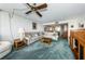 Cozy living room area with ceiling fan and green carpet at 300 Woodette Dr # 202B, Dunedin, FL 34698