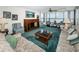Spacious living room with scenic views, comfortable seating, and a ceiling fan at 300 Woodette Dr # 202B, Dunedin, FL 34698