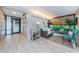 Condo lobby with comfortable seating, elegant decor, and tile flooring at 300 Woodette Dr # 202B, Dunedin, FL 34698