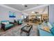 Inviting resident lounge with comfortable seating, elegant decor, and plenty of natural light at 300 Woodette Dr # 202B, Dunedin, FL 34698