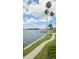 Enjoy a walk along the water, passing by beautiful palm trees at 300 Woodette Dr # 202B, Dunedin, FL 34698