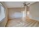 Bright bedroom with vaulted ceilings and laminate wood flooring at 3460 Countryside Blvd # 59, Clearwater, FL 33761