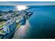 Aerial view of waterfront community with building and landscaping at 300 Woodette Dr # 202B, Dunedin, FL 34698