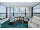 Living room with water view and comfortable seating at 300 Woodette Dr # 202B, Dunedin, FL 34698