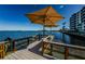Relaxing pier with shaded seating at 300 Woodette Dr # 202B, Dunedin, FL 34698