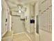 Bright laundry room with built-in cabinets and storage at 100 Bluff View Dr # 208B, Belleair Bluffs, FL 33770