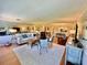 Open living room with hardwood floors and access to multiple rooms at 100 Bluff View Dr # 208B, Belleair Bluffs, FL 33770