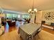 Living room with hardwood floors, comfortable furniture, and a dining area at 100 Bluff View Dr # 208B, Belleair Bluffs, FL 33770