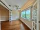 Bright bedroom with hardwood floors and large windows at 100 Bluff View Dr # 208B, Belleair Bluffs, FL 33770