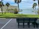 Relaxing seating area overlooking waterfront with a bench at 100 Bluff View Dr # 208B, Belleair Bluffs, FL 33770