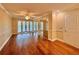 Spacious Primary bedroom with hardwood floors and French doors at 100 Bluff View Dr # 208B, Belleair Bluffs, FL 33770