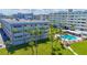 Aerial view of the building, pool, and surrounding area at 100 Bluff View Dr # 208B, Belleair Bluffs, FL 33770