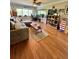 Living Room with hardwood floors, sectional sofa, and built-in shelving at 100 Bluff View Dr # 208B, Belleair Bluffs, FL 33770