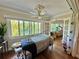 Relaxing bedroom with large windows and a massage table at 100 Bluff View Dr # 208B, Belleair Bluffs, FL 33770