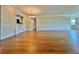 Dining room with hardwood floors and a view into the living room at 100 Bluff View Dr # 208B, Belleair Bluffs, FL 33770