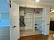Storage room with shelving and HVAC unit at 100 Bluff View Dr # 208B, Belleair Bluffs, FL 33770