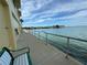 Relaxing waterfront walkway with benches and views of the water at 100 Bluff View Dr # 208B, Belleair Bluffs, FL 33770