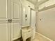 Laundry room with utility sink and ample cabinet space at 100 Bluff View Dr # 208B, Belleair Bluffs, FL 33770