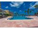 Community pool with patio furniture and waterfront view at 100 Bluff View Dr # 208B, Belleair Bluffs, FL 33770