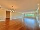 Bright living room with hardwood floors and abundant natural light at 100 Bluff View Dr # 208B, Belleair Bluffs, FL 33770