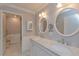Elegant bathroom with double vanity and marble countertops at 100 Bluff View Dr # 208B, Belleair Bluffs, FL 33770