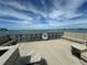 Community pier with benches and life preserver at 100 Bluff View Dr # 208B, Belleair Bluffs, FL 33770