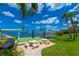 Community shuffleboard courts with picnic tables near the waterfront at 100 Bluff View Dr # 208B, Belleair Bluffs, FL 33770