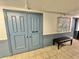 Entrance to clubhouse with artwork and seating at 100 Bluff View Dr # 208B, Belleair Bluffs, FL 33770