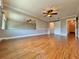 Primary bedroom with hardwood floors and multiple access points at 100 Bluff View Dr # 208B, Belleair Bluffs, FL 33770