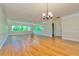 Living room featuring hardwood floors and a view of the outdoors at 100 Bluff View Dr # 208B, Belleair Bluffs, FL 33770