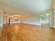 Spacious living room featuring hardwood floors and abundant natural light at 100 Bluff View Dr # 208B, Belleair Bluffs, FL 33770
