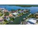 Aerial view showcasing a waterfront property with dock and canal access at 1932 Arrowhead Ne Dr, St Petersburg, FL 33703