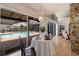 Dining area with pool view through sliding glass doors at 1932 Arrowhead Ne Dr, St Petersburg, FL 33703