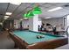Relaxing game room features a pool table, fitness equipment, and a sitting area at 6268 Palma Del Mar S Blvd # 407, St Petersburg, FL 33715