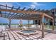 Relaxing hot tub area with pergola and waterfront views at 6268 Palma Del Mar S Blvd # 407, St Petersburg, FL 33715