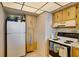Kitchen with wood cabinets and appliances at 6268 Palma Del Mar S Blvd # 407, St Petersburg, FL 33715