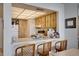 Kitchen with light wood cabinets and breakfast bar at 6268 Palma Del Mar S Blvd # 407, St Petersburg, FL 33715