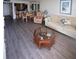 Open-concept living room with wood flooring, neutral tones, dining area, and comfortable seating at 6268 Palma Del Mar S Blvd # 407, St Petersburg, FL 33715