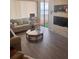 Cozy living room with water views, wood floors, comfortable seating, and a functional workspace at 6268 Palma Del Mar S Blvd # 407, St Petersburg, FL 33715