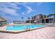 Inviting swimming pool with surrounding patio and beach access at 6268 Palma Del Mar S Blvd # 407, St Petersburg, FL 33715