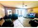 Living room with bay window, seating, and TV at 11598 Ridge Rd, Largo, FL 33778