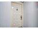 White door with brass hardware, leading to a condo unit at 6268 Palma Del Mar S Blvd # 407, St Petersburg, FL 33715